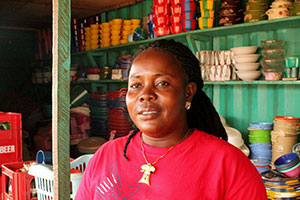 Tina Tuonyon is a 37-year-old single mother who used to sell charcoal at a small market stall. She is now a cross-border trader with a big clothing and household goods shop. Photo: UN Women/Arwen Kidd