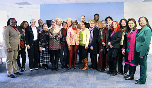 UN Women Executive Director Phumzile Mlambo-Ngcuka (front centre) and Deputy Executive Director Lakshmi Puri (far right), pose with members of UN Women’s Global Civil Society Advisory Group, which met in New York on 12 February 2014. 