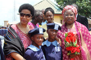 UN Women Executive Director Phumzile Mlambo-Ngcuka (left), and Nigeria's Minister of Women Affairs and Social Development Hajiya Zainab Maina (right), with two young girls from the Federal Government Girls College (FGGC) in Abaji, Nigeria. Photo: UN Women/Mariam Kamara