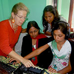 Bianca Miglioretto explaining studio operation to Nepalese women community radio broadcasters during a training session in Chitwan, 2011. Photo credit: Sarina/Community Radio Vijaya FM101.6
