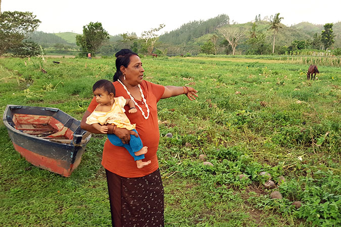 Raj Wati showing part of her farm that was destroyed by flooding. Photo: Kasanita Isimeli.