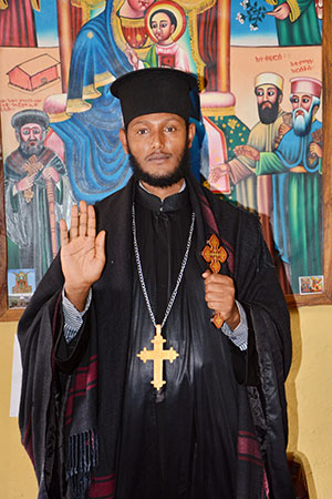 Ababa Enbakom Chanie Workineh, General Manager of East Gojam Diocese Office, Amhara- holding his hand up as a stop violence against women and girls sign, Photo Credit- Paula Mata/UN Women