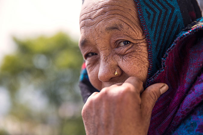 After surviving under rubble for five days, Maali Gurung was found by her neighbors relatives and airlifted to Gorkha Bazaar for medical treatment. Photo: UN Women/Narendra Shrestha