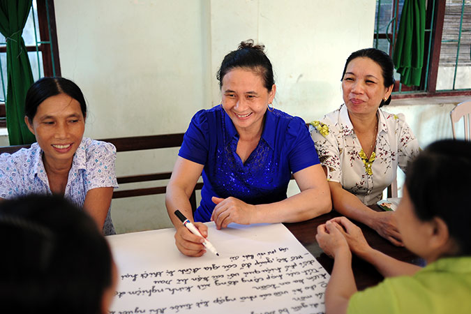 Ly Nguyen, a local leader from Phong Thuy commune, now has an official place at the commune’s Committee for Natural Disaster Prevention and Control and participates in decision-making and planning of actions during the storm season. Photo: UN Women Viet Nam/Hoang Hiep