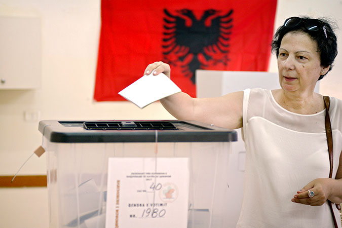 A woman voting on election day, 25 June 2017. Photo: UN Women/Violana Murataj
