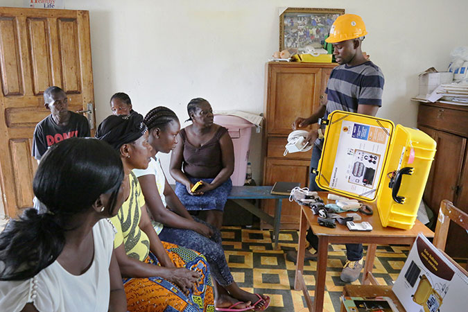 Nurses and health workers at all of the 37 clinics supported with the solar lights have been trained in the maintenance and operations of the systems. Photo: UN Women/Winston Daryoue 