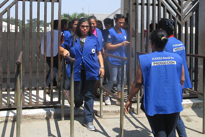 María Gutiérrez leaving the industrial estate of Delta Honduras, the textile company where she works  UN Women/Héctor Gómez