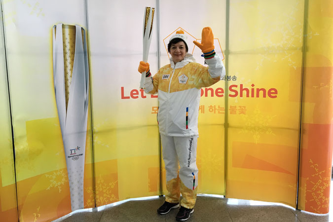 UN Women Country Programme Manager in China Julie Broussard holds the Olympic Torch in Paju, South Korea