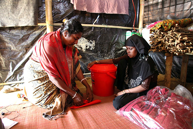 Rohingya women in Cox's Bazar receive dignity kits from UN Women, in partnership with the Ministry of Women and Children Affairs  and ActionAid Bangladesh. Photo: ActionAid Bangladesh/Md. Sariful Islam