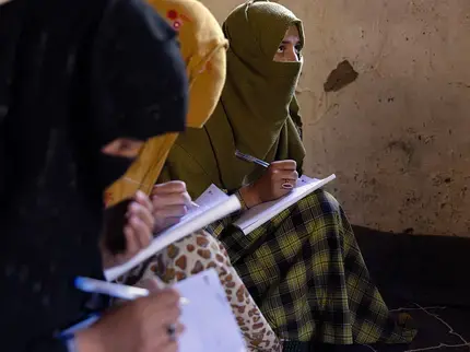 Women learn to read and write through a literacy initiative supported by UN Women, in Nuristan province, eastern Afghanistan. As part of the initiative, 130 Village Literacy Committees were also established. By improving their literacy, the women can also strengthen their livelihoods, access to healthcare and build their resilience, in one of the most isolated and underserved provinces in Afghanistan. Photo: UN Women/Sayed Habib Bidell