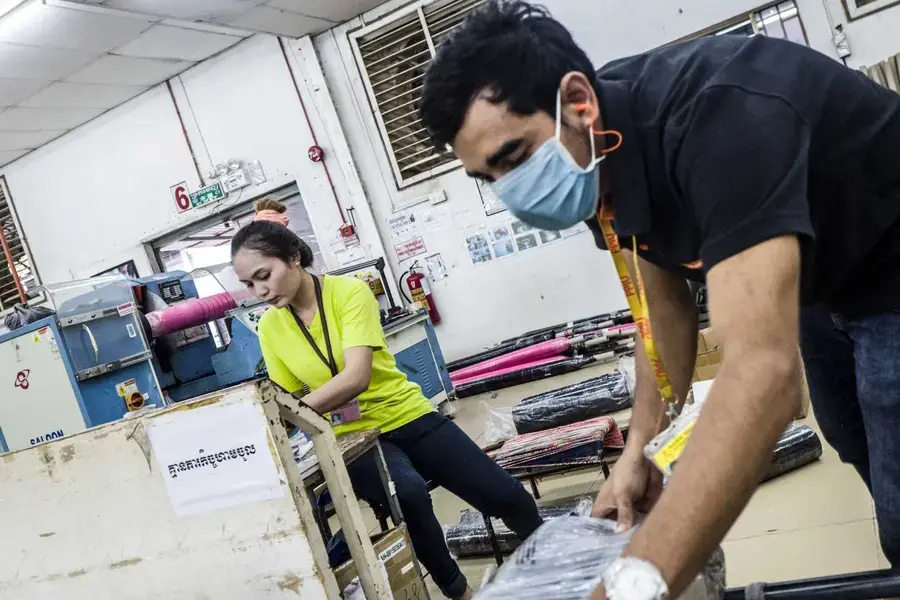 Garment factory workers in Sangkat Chaom Chao, Cambodia. The factory is at the forefront in addressing and fighting sexual harassment in the work place. Photo: UN Women/Charles Fox.