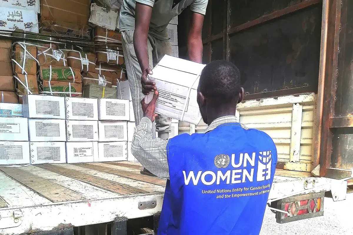UN Women staff load humanitarian supplies to be distributed to women in Sudan.