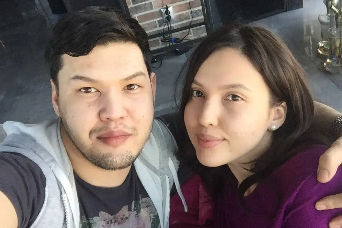Siblings Saltanat Nukenova (at right) and Aitbek Amangeldi take a photo together in 2017.  Photo: Courtesy of Aitbek Amangeldi