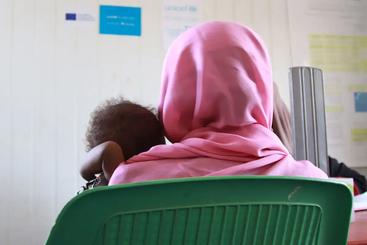 A mother and her one-year-old daughter with severe acute malnutrition receive treatment at the Hayal Arab health facility in Atbara, River Nile state, Sudan.