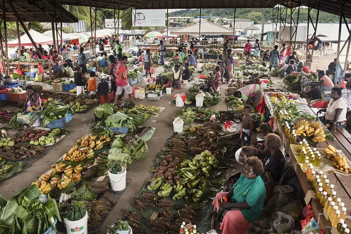 An overhead view of a market selling fresh produce and other goods