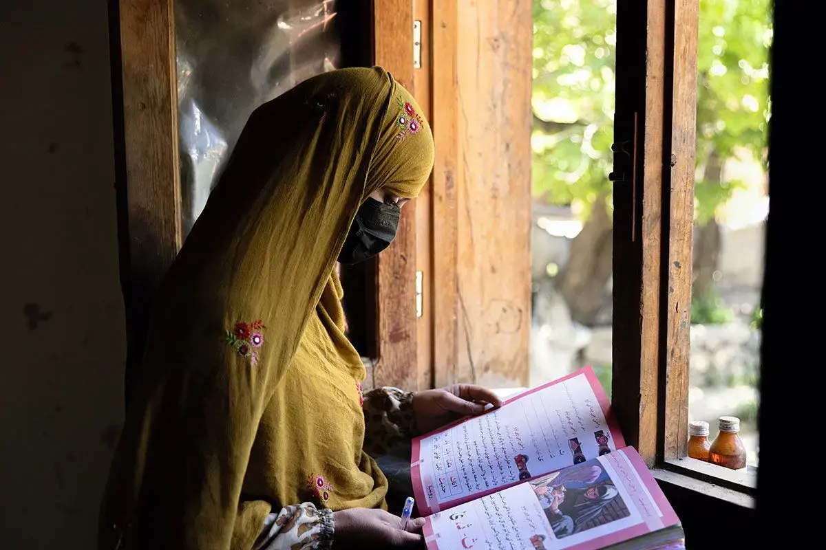 Women learn to read and write through a literacy initiative supported by UN Women, in Nuristan province, eastern Afghanistan. As part of the initiative, 130 Village Literacy Committees were also established, to help reach vulnerable women and girls, particularly in more remote communities. By improving their literacy, the women can also strengthen their livelihoods and build their resilience, in one of the most isolated and underserved provinces in Afghanistan. Photo: UN Women/Sayed Habib Bidell