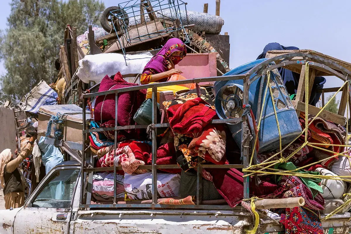 For Afghan women and girls returning to Afghanistan, even the journey itself can be hot, uncomfortable and dangerous. Many travel in trucks, sitting on top of their family's belongings. Women humanitarians supporting them at border crossings report hearing stories of girls travelling without their parents, and of women going into early labour along the way. Photo: UN Women/Sayed Habib Bidell