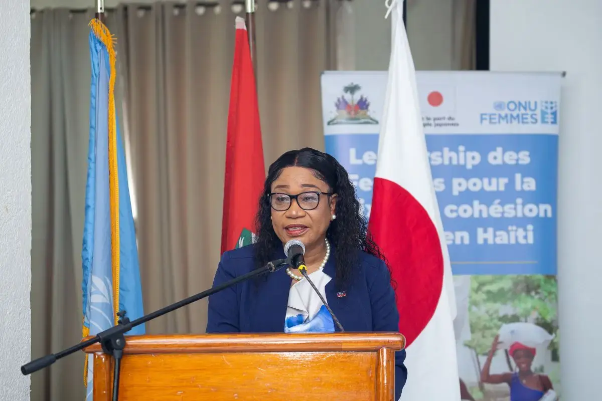 A woman speaks at a podium