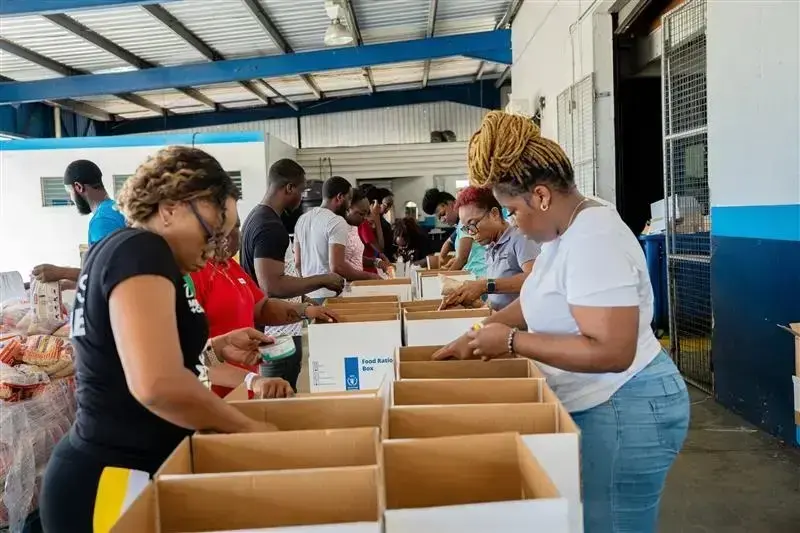 WFP volunteers packing relief supply boxes