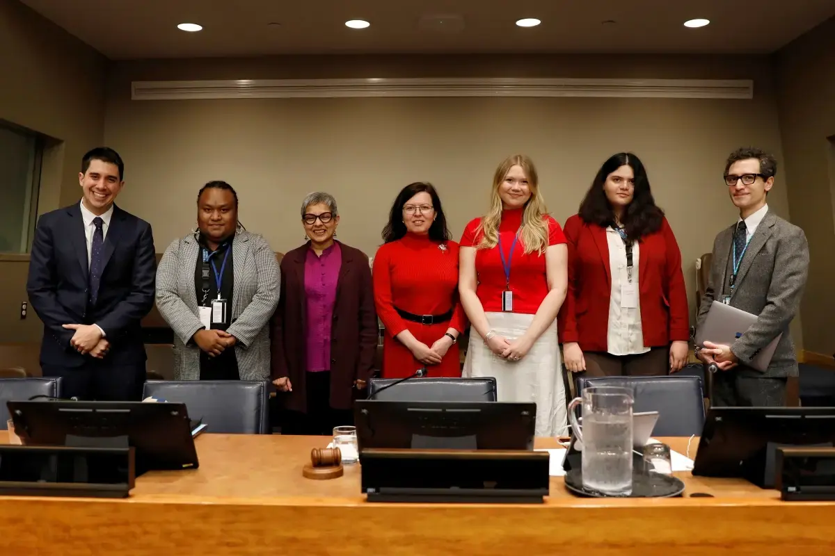 Youth leaders stand with UN representatives at CSW70