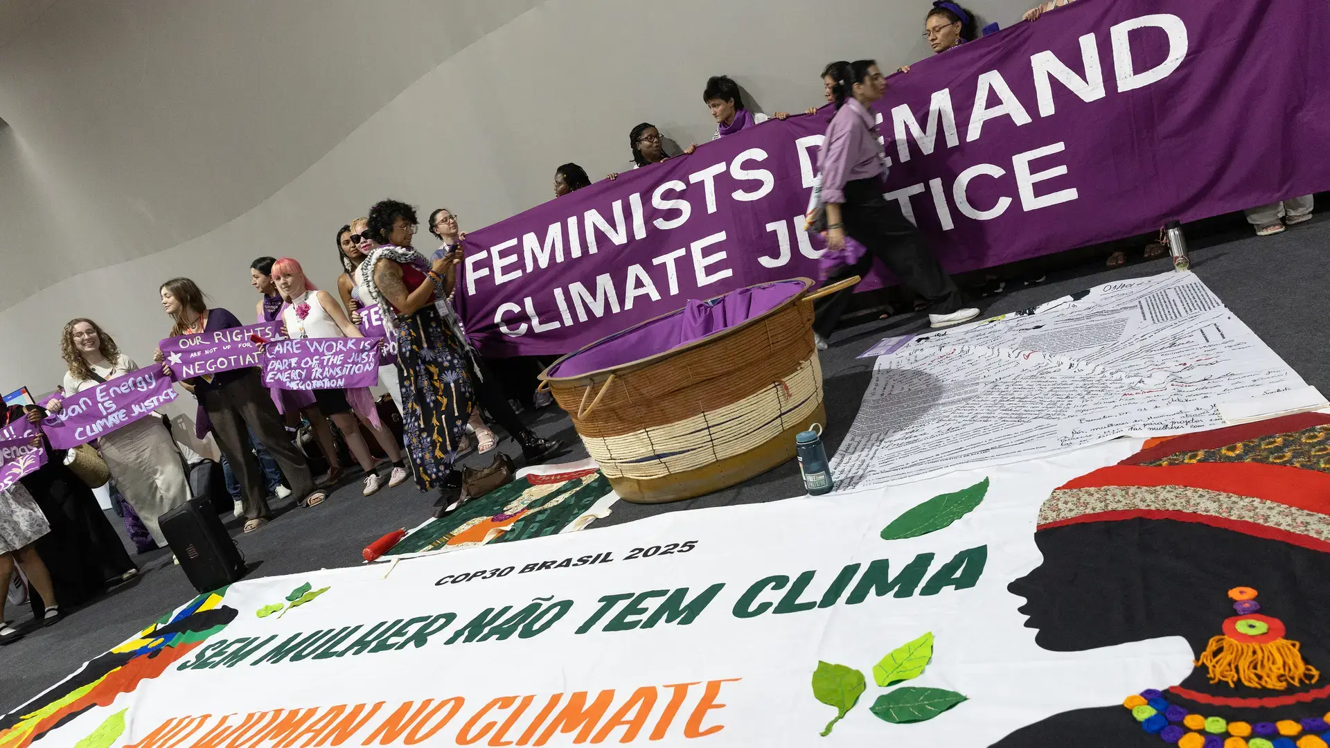 Delegates at COP30 in Belém, Brazil demonstrate to raise awareness about the gender dimension of climate justice