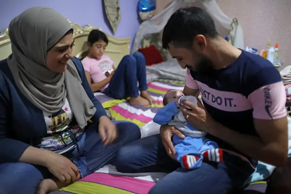 The couple take turns caring for Walid, their son, whether it’s bottle feeding, childcare or other housework. Photo: UN Women/Marwan Tahtah.