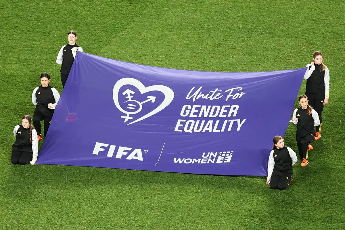 Dalian Wanda Flag Bearers display a “Unite for gender equality” banner during the FIFA Women’s World Cup 2023 Group E match between Portugal and USA on 1 August 2023 in Auckland/Tāmaki Makaurau, New Zealand. Photo: FIFA/Fiona Goodall.